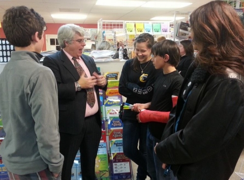 This is me talking with some homeschool students at The Homeschool Gathering Place.  I ended up signing the young man's cast, which was surprisingly difficult because of its texture.