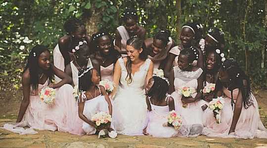 Katie Davis and her 13 adopted daughters on her wedding day.