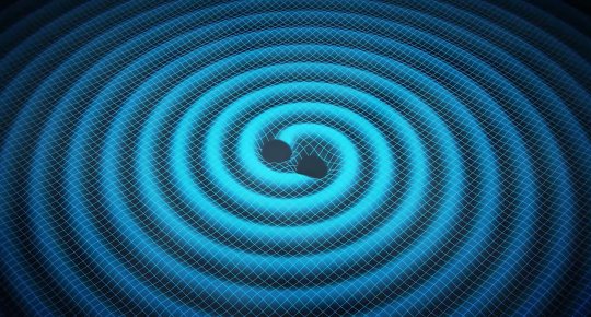 This is an artist's conception of two merging black holes and the gravity waves they generate. 